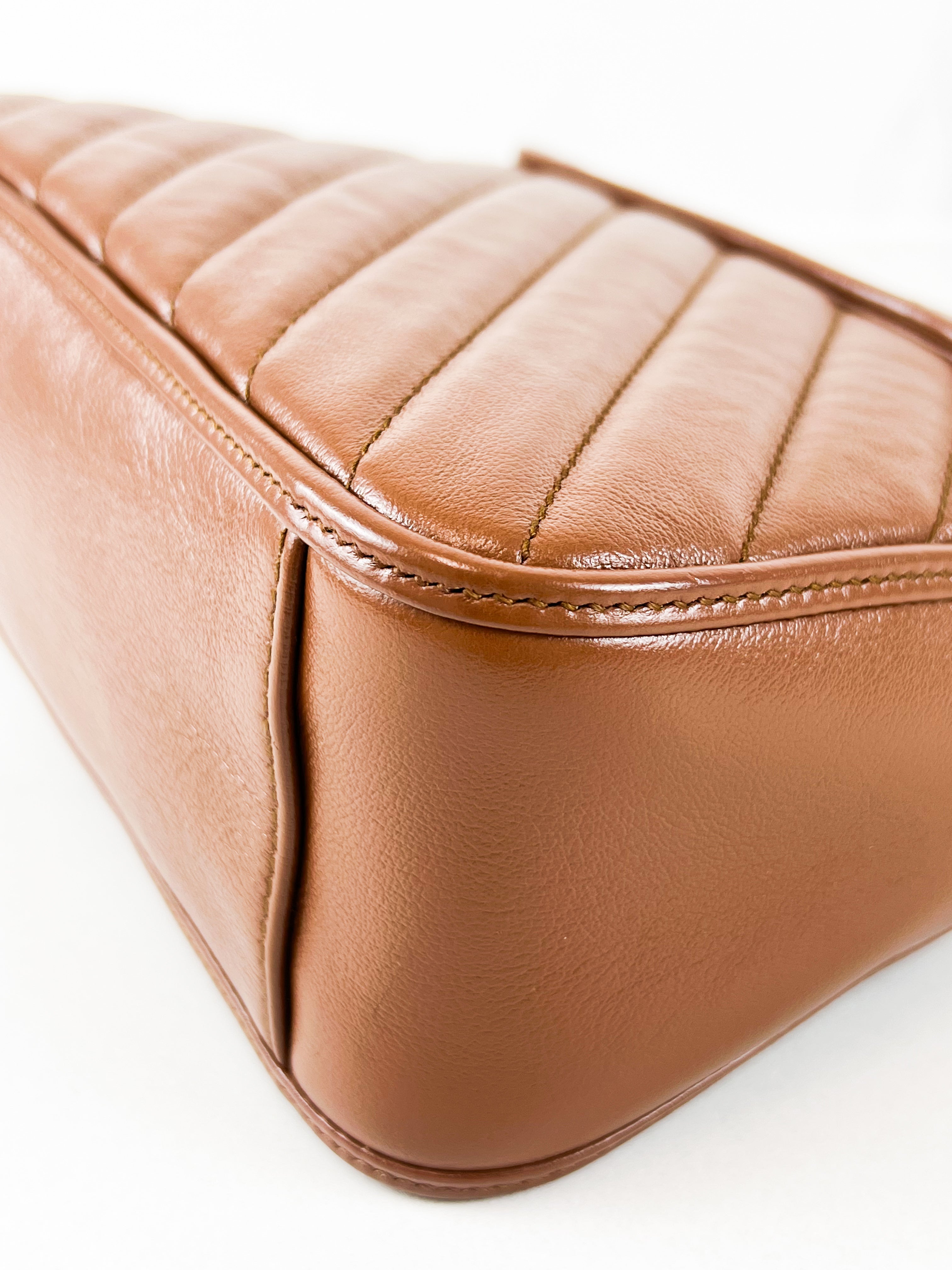 Gucci GG Marmont Matelasse Top Handle Bag in Brown