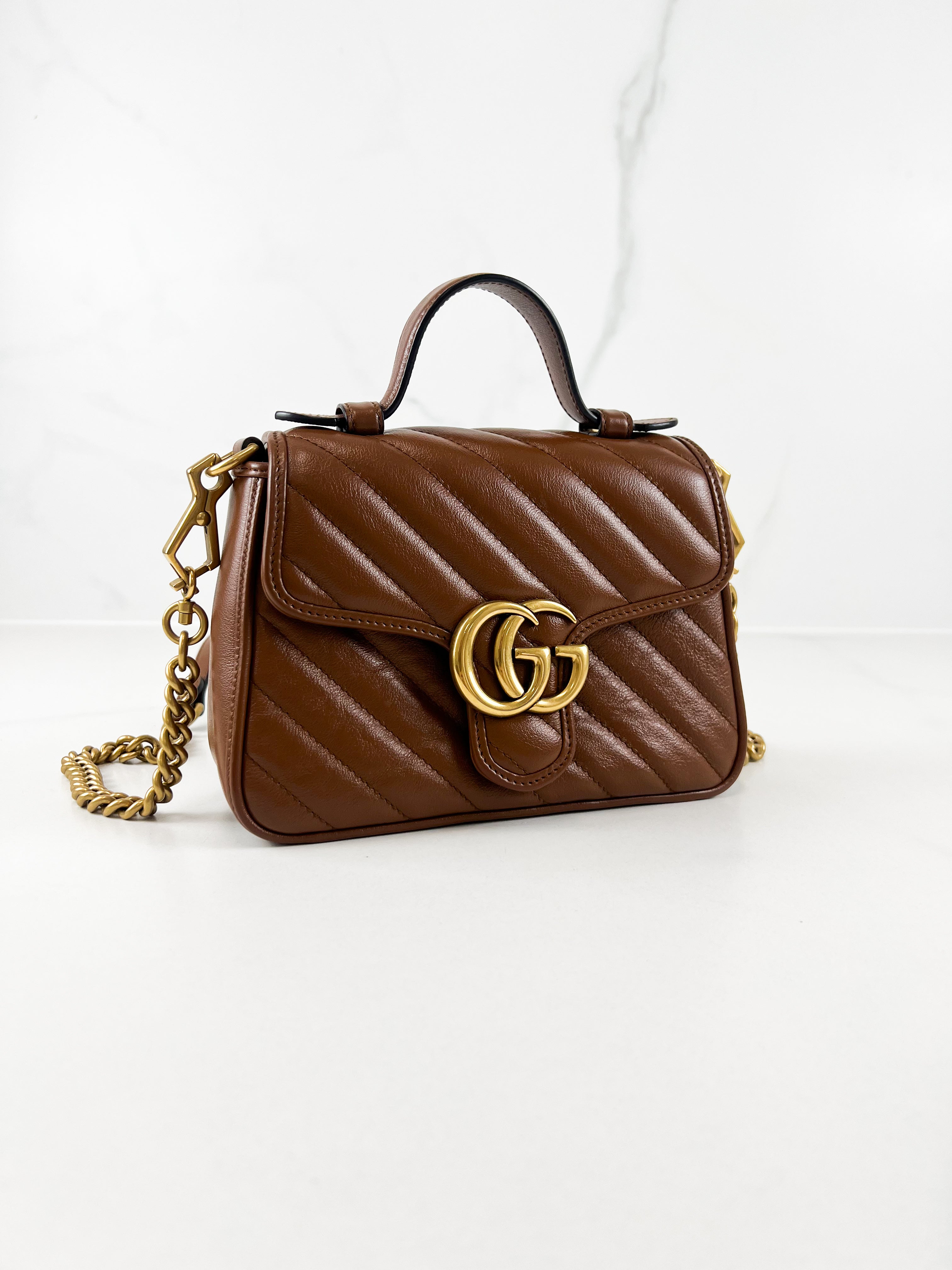 Gucci GG Marmont Matelasse Top Handle Bag in Brown