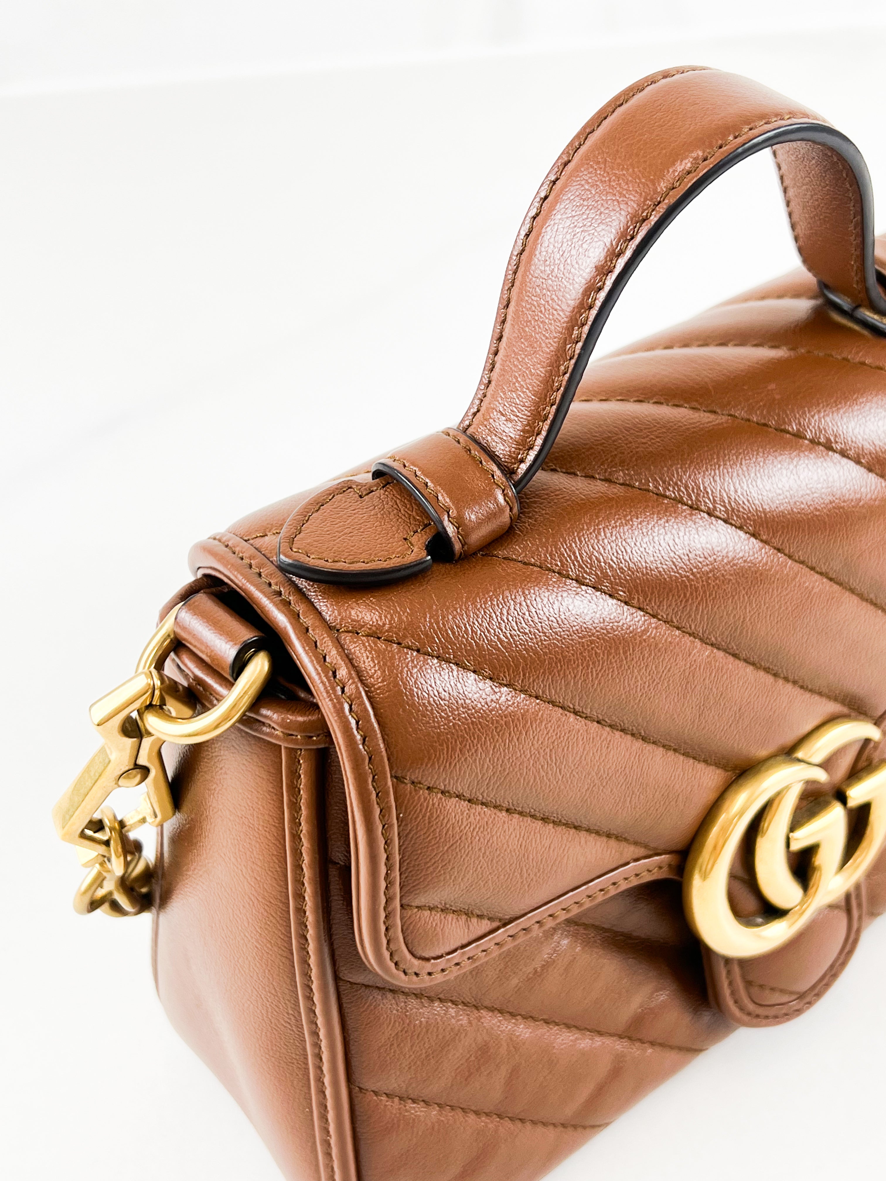 Gucci GG Marmont Matelasse Top Handle Bag in Brown