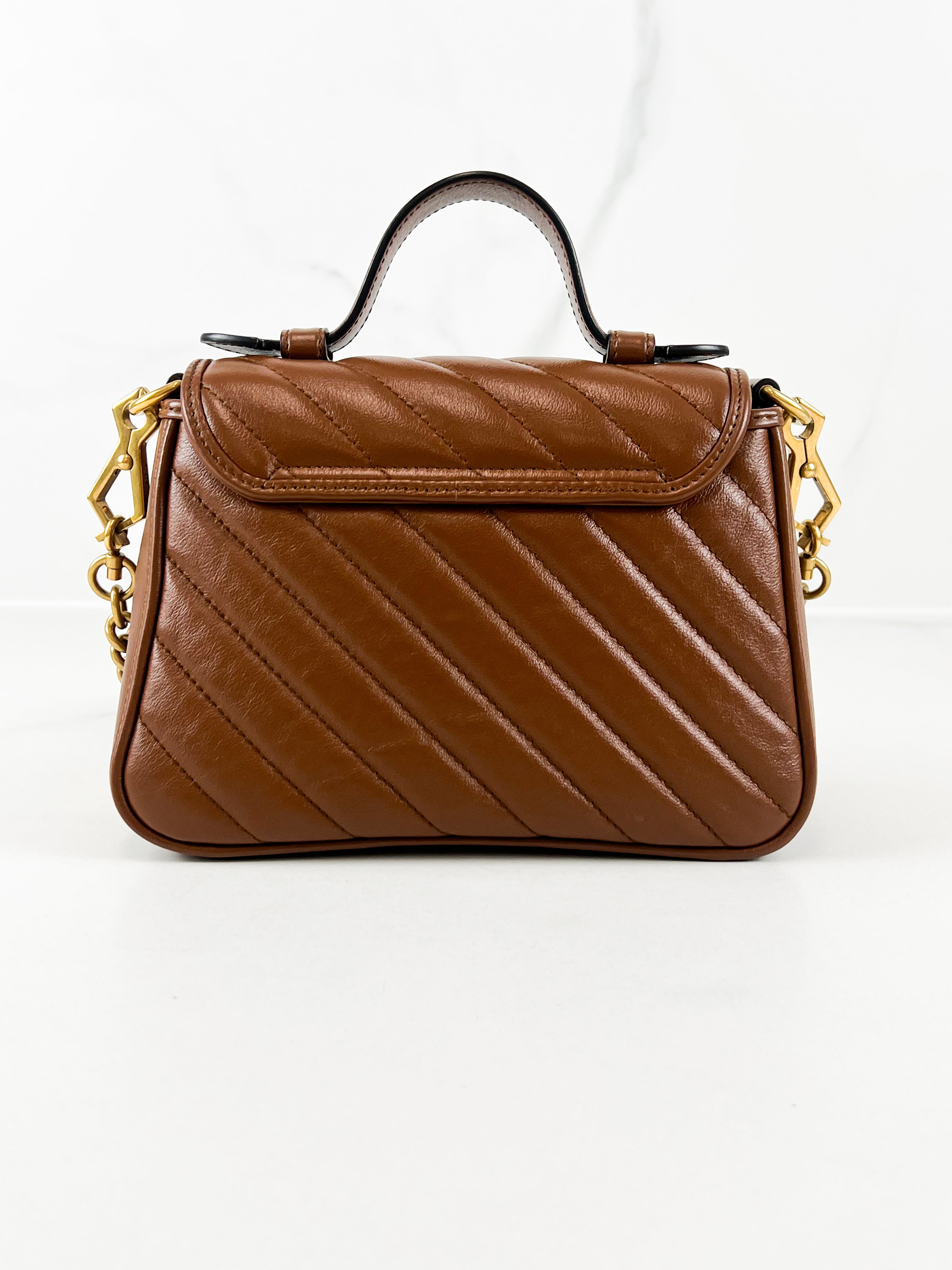 Gucci GG Marmont Matelasse Top Handle Bag in Brown