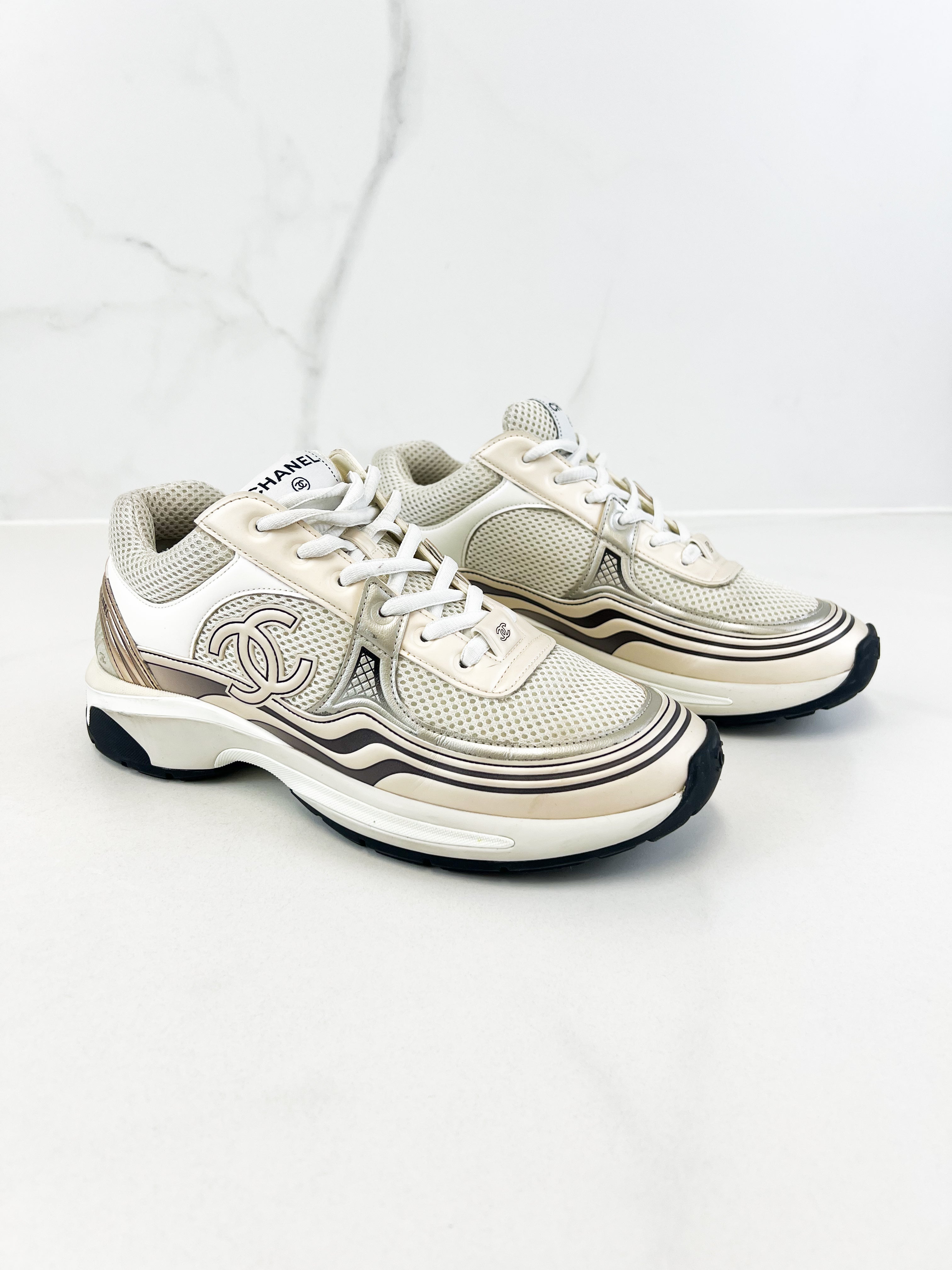 Chanel Laminated Leather and Fabric CC Low Top Sneakers In Ivory, White & Silver Size 39.5