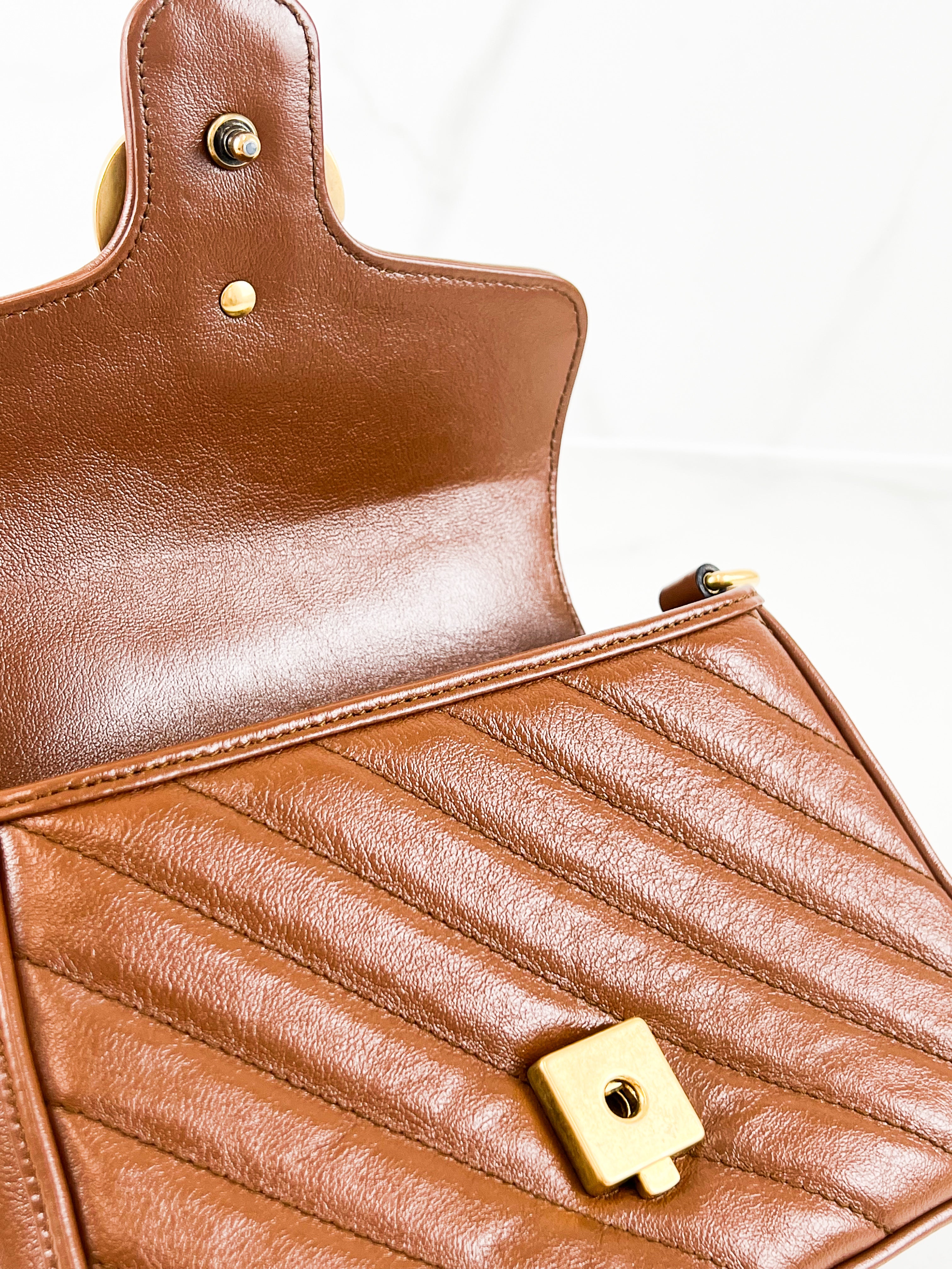 Gucci GG Marmont Matelasse Top Handle Bag in Brown