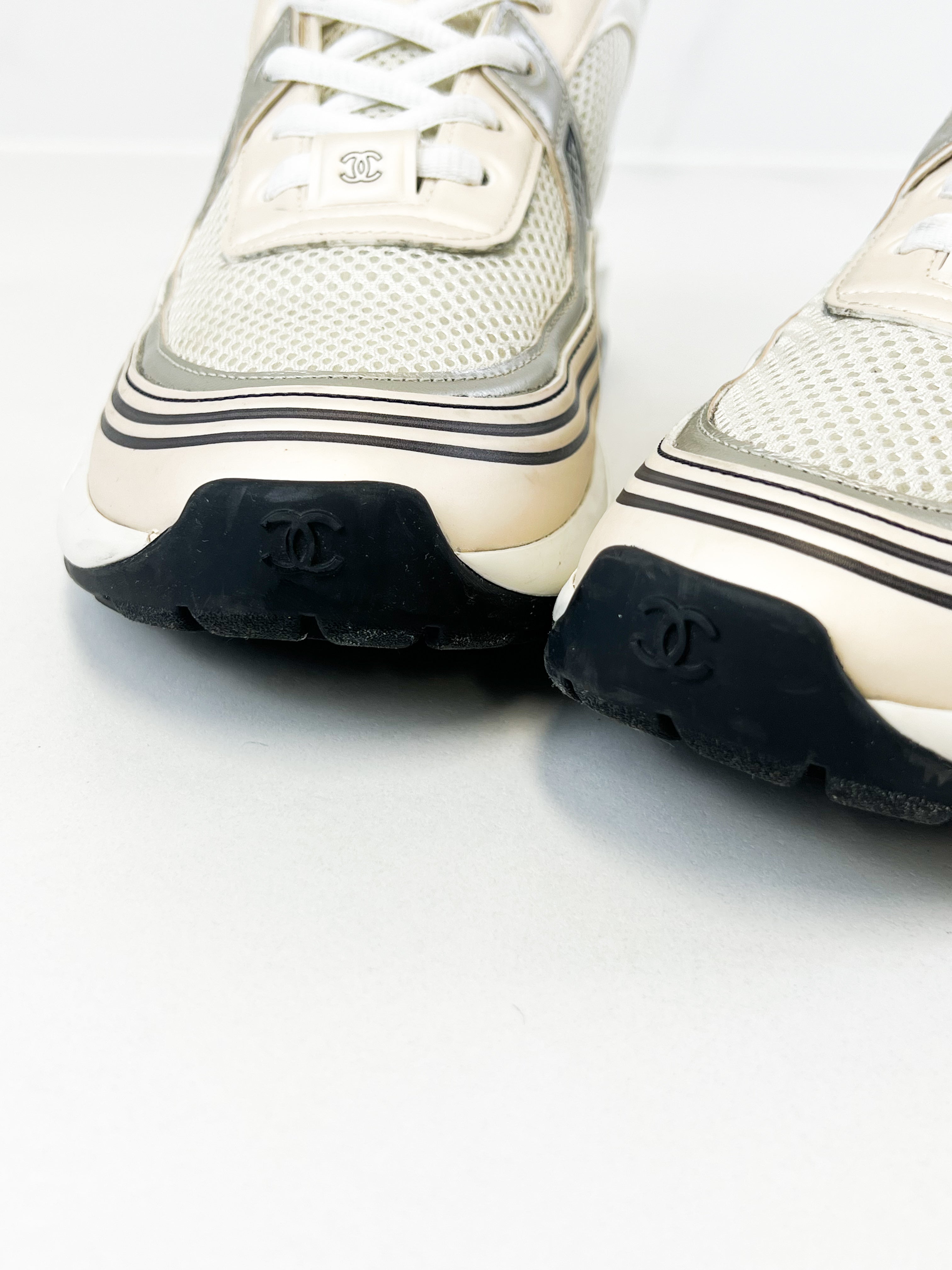 Chanel Laminated Leather and Fabric CC Low Top Sneakers In Ivory, White & Silver Size 39.5