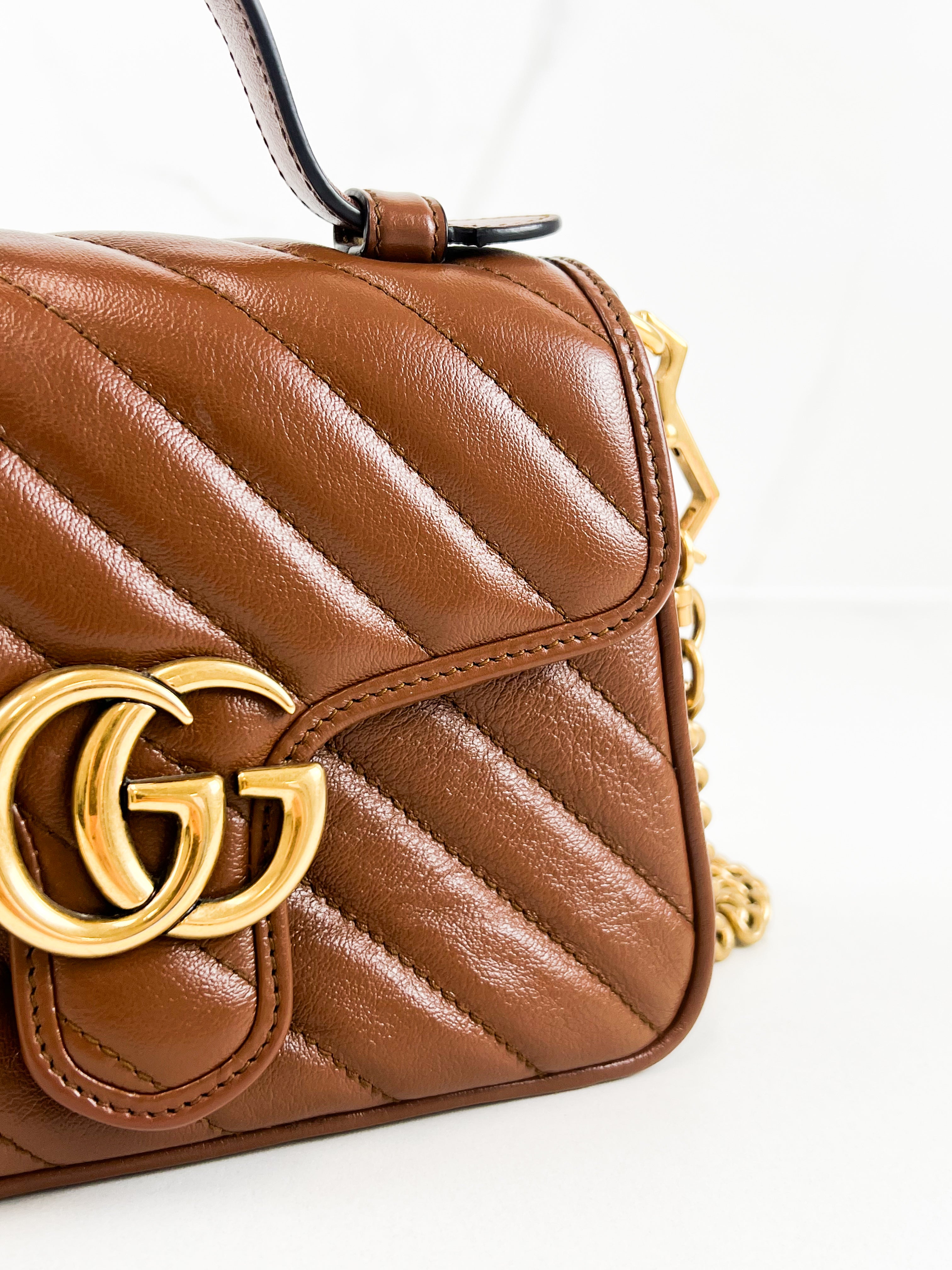 Gucci GG Marmont Matelasse Top Handle Bag in Brown