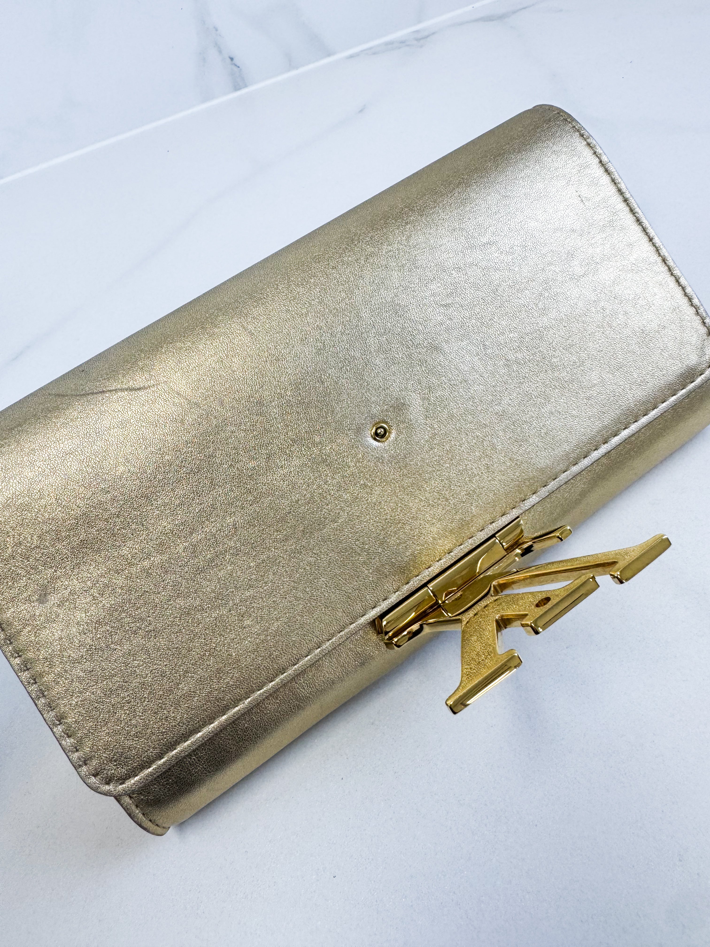 Louis Vuitton Gold St Louise Clutch