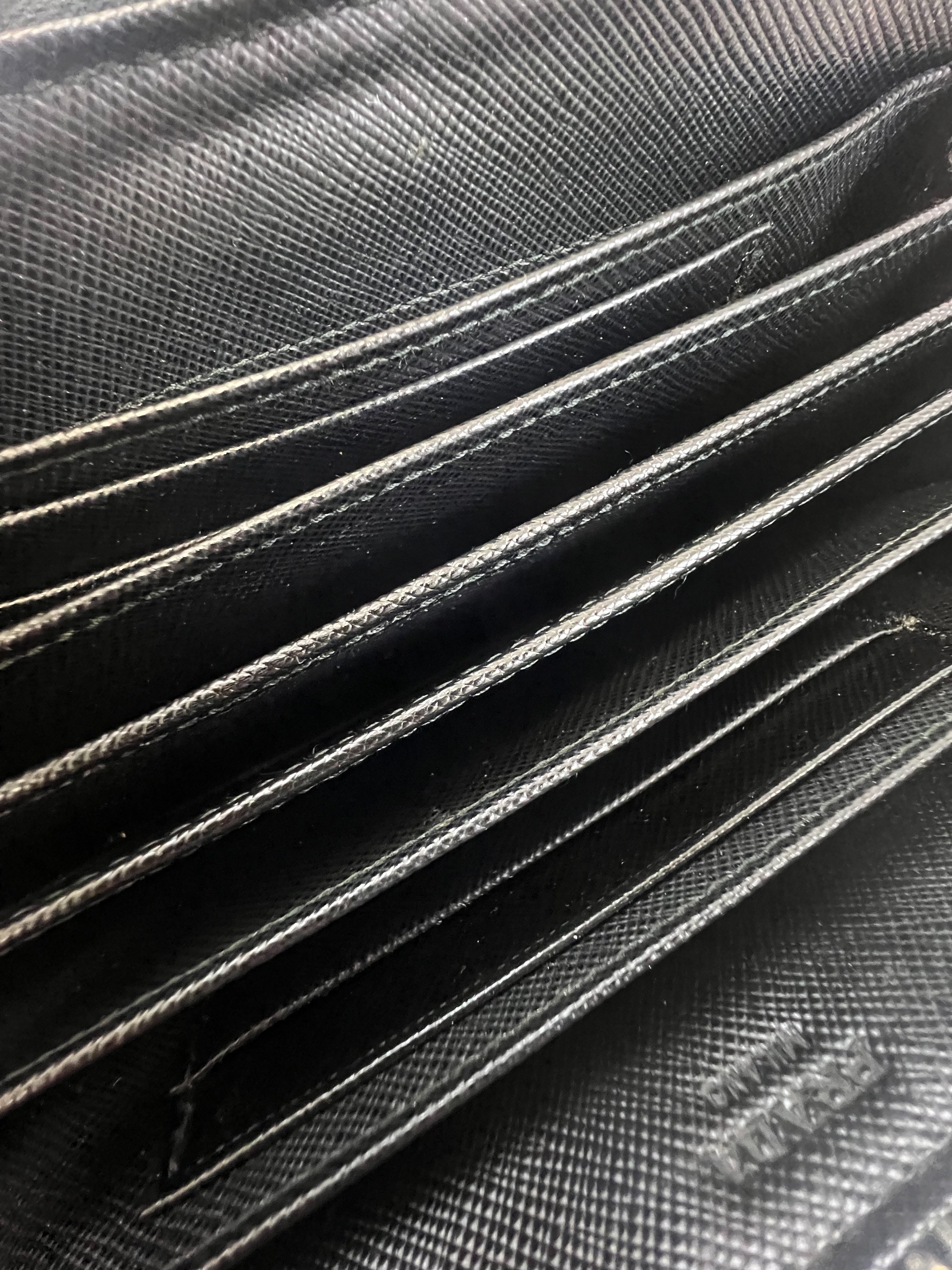 Prada Large Grained Leather Zip Around Wallet