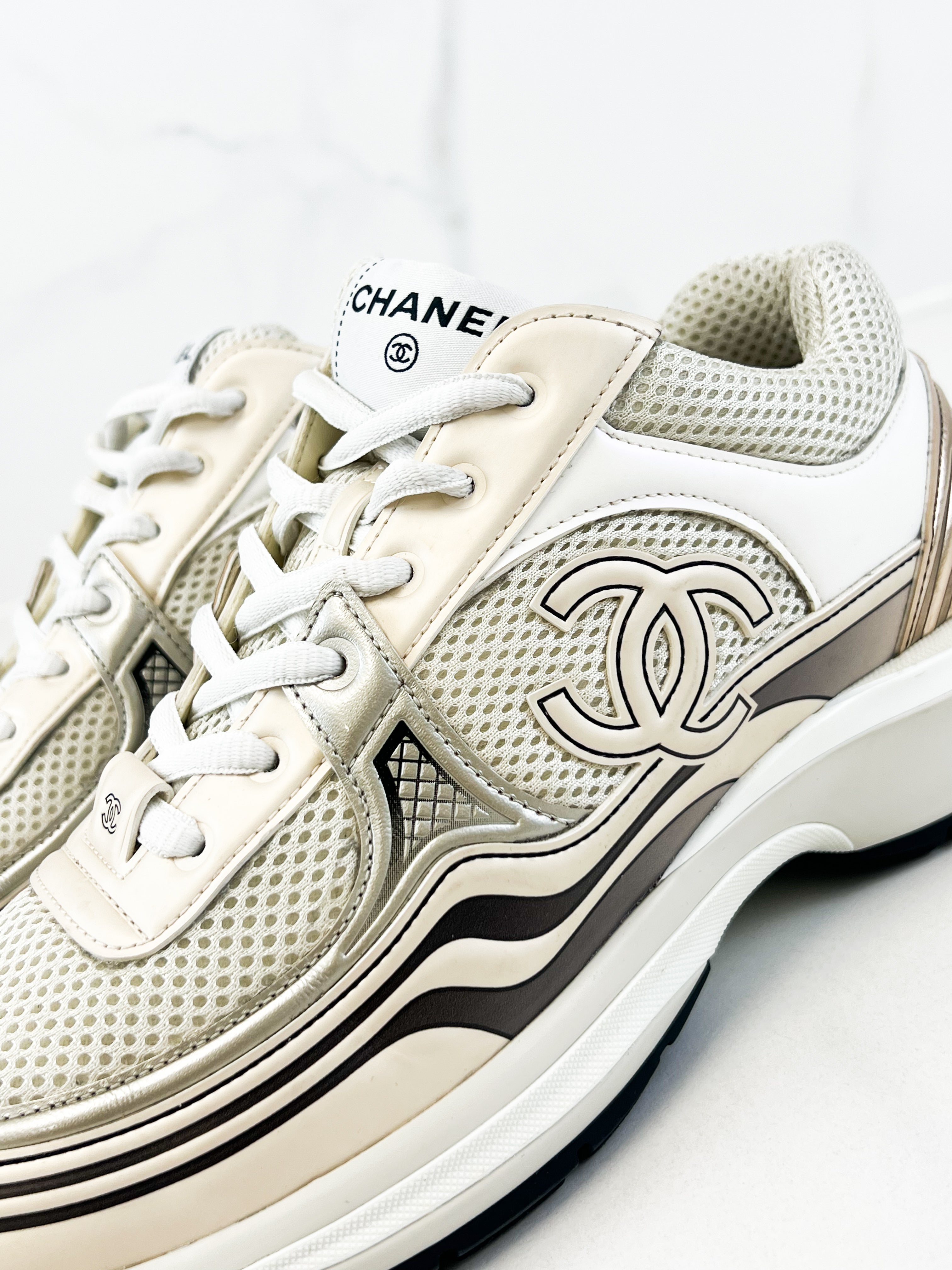 Chanel Laminated Leather and Fabric CC Low Top Sneakers In Ivory, White & Silver Size 39.5