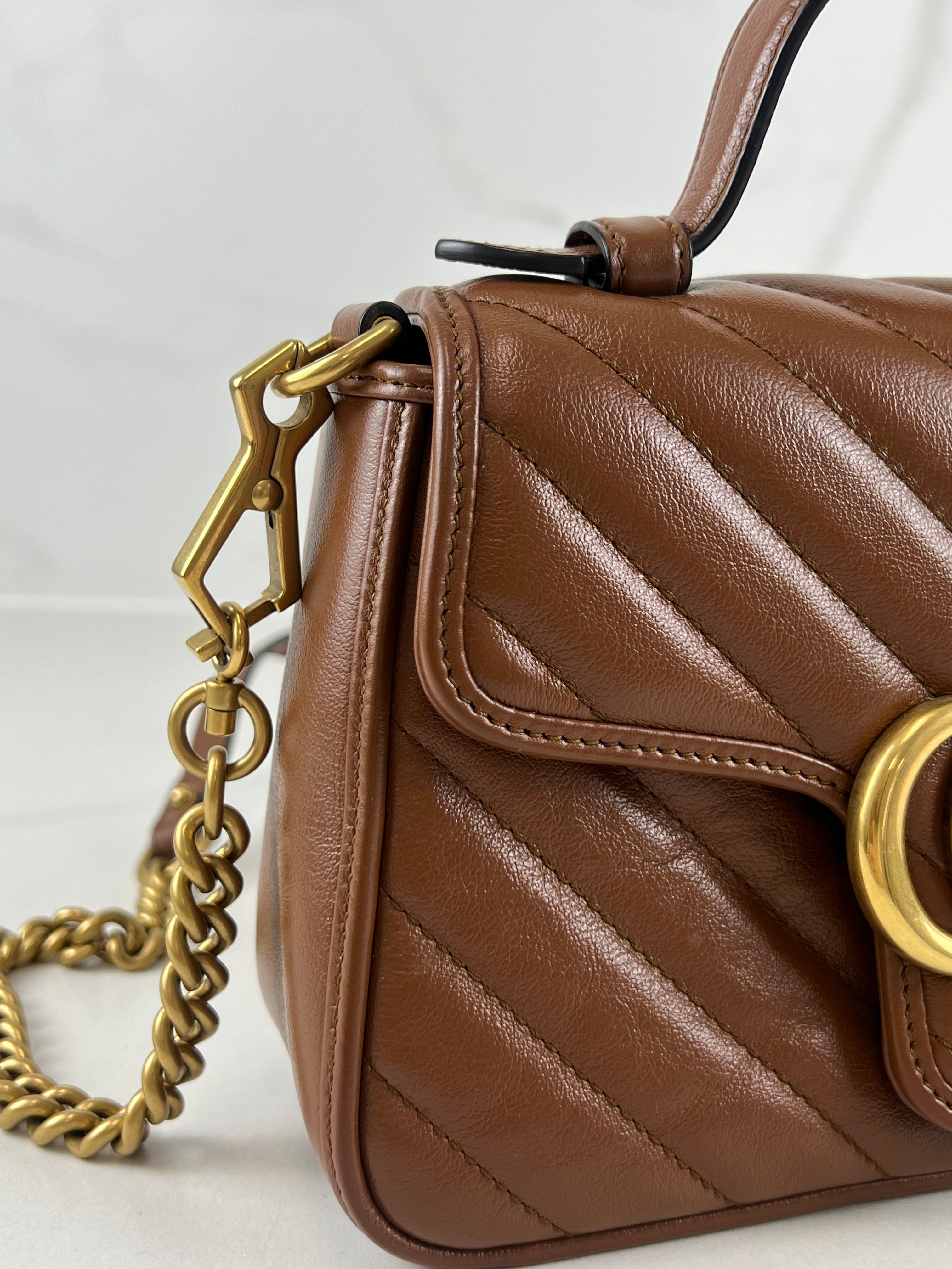 Gucci GG Marmont Matelasse Top Handle Bag in Brown