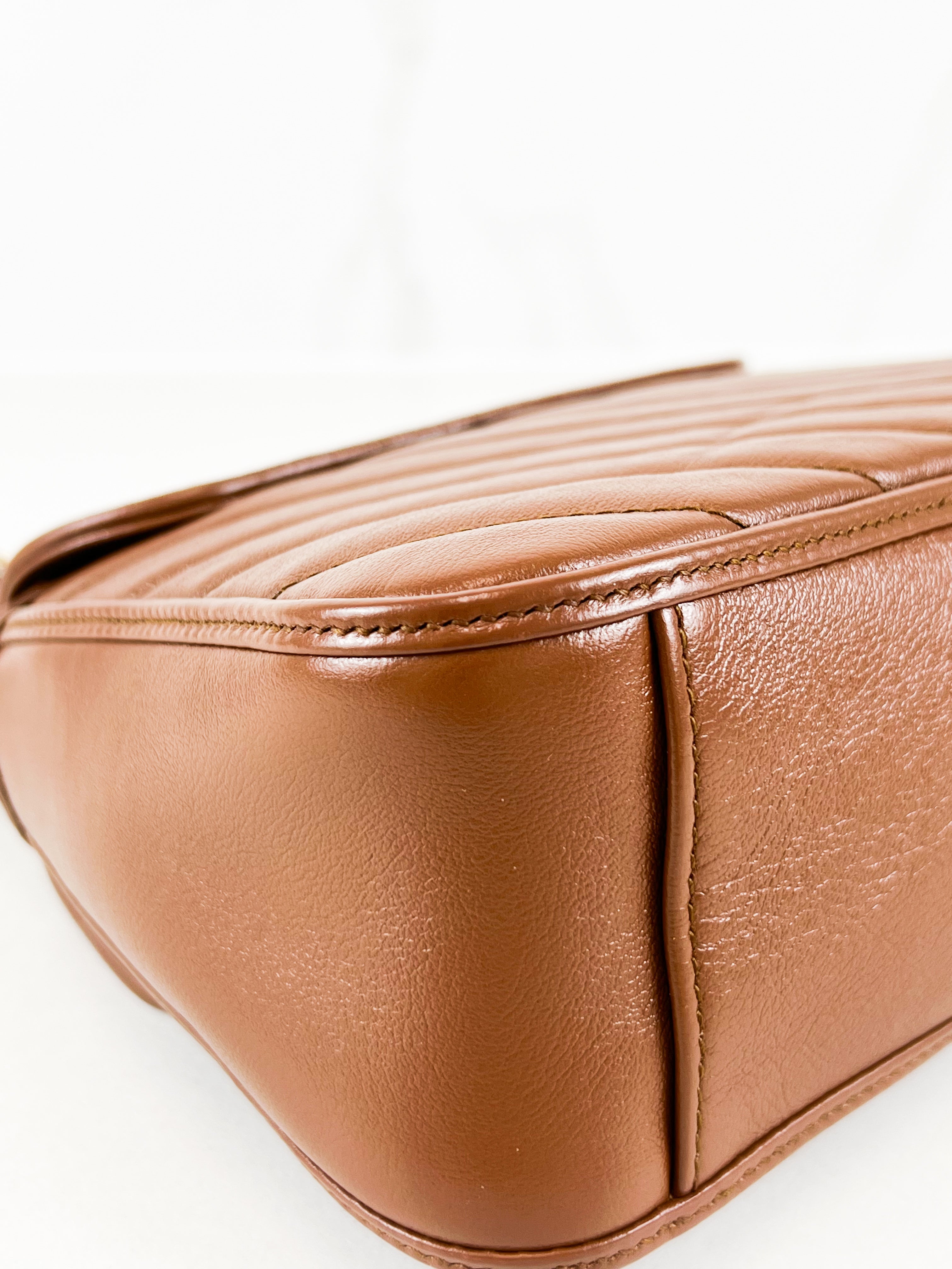 Gucci GG Marmont Matelasse Top Handle Bag in Brown