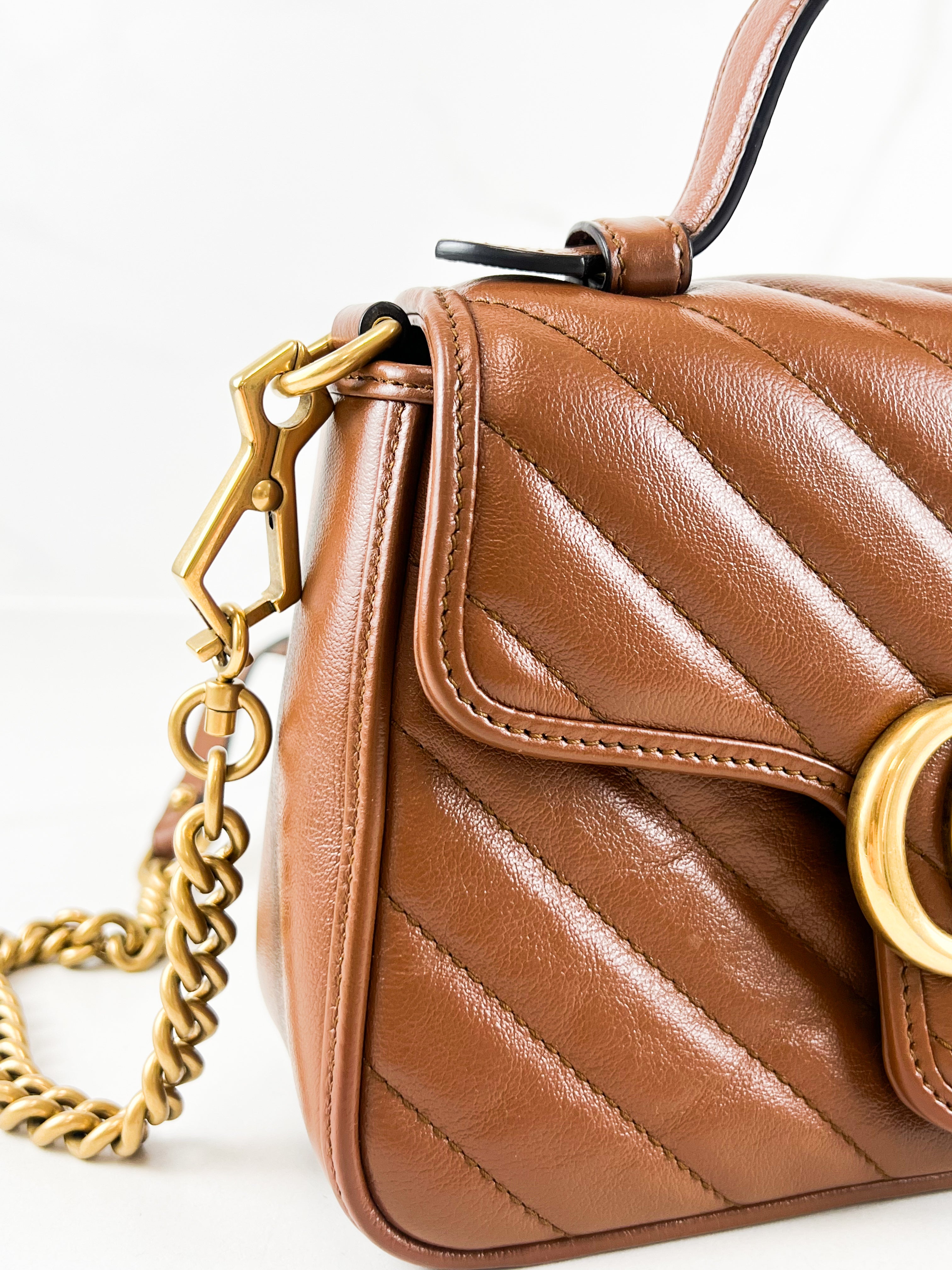 Gucci GG Marmont Matelasse Top Handle Bag in Brown